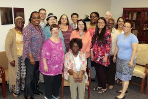 Dana Library colleagues of longtime Circulation Desk supervisor Joyce Watson joined her in celebrating her retirement after 15 years with Rutgers University Libraries, effective June 30. From left: Maggie Harris-Clark, Alex and Doris Arencibia, Natalie Borisovetz (foreground), Andrea Lakios, Ka-Nang Au, Linda Becker, Joyce Watson (foreground, seated), Amber Judkins, Bonnie Fong, Robert Nahory, Dorothy Grauer, Janet Giorgio, and Library Director Consuella Askew. Photograph by Mark Papianni.