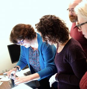 Staff examines microfilm