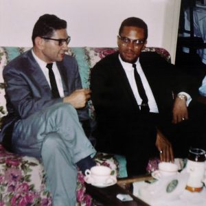 Morroe Berger and Malcolm X listen to jazz records. photo credit: Ed Berger.