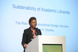 Librarian on stage presenting