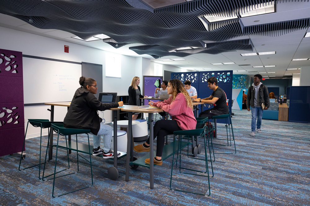 IDEA students discuss a project in the Hatchery’s Learning Bar (Area 10). Photo by John Emerson.