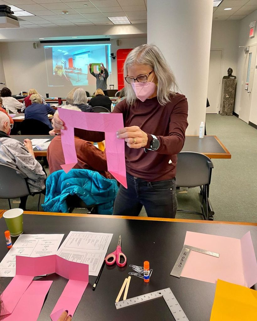 Catherine LeCleire conducts the triangle book-making workshop.