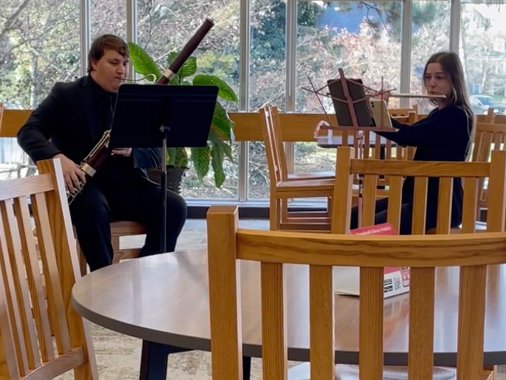 Douglass pop-up concert featuring a flute and bassoon duo.