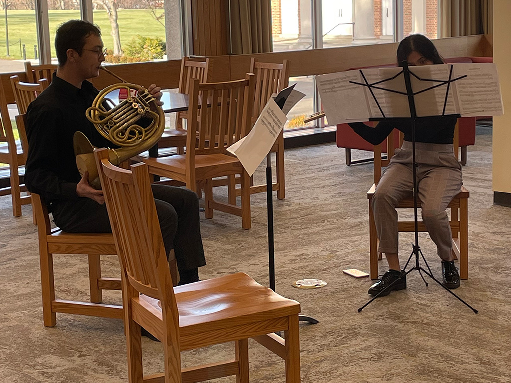 Douglass pop-up concert featuring a flute and French horn duo.