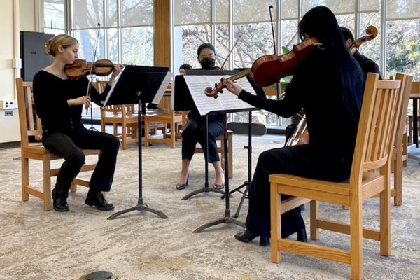 Douglass pop-up concert featuring a string quartet.
