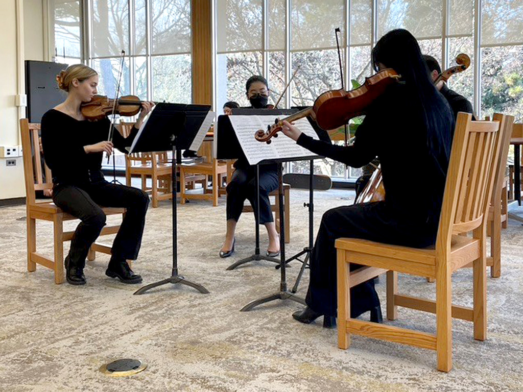 Douglass pop-up concert featuring a string quartet.