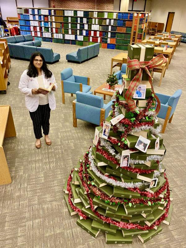 RWJ Library's 2022 holiday book tree and book billboard.