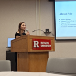 A person speaks at a podium