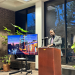 A person speaks at a podium