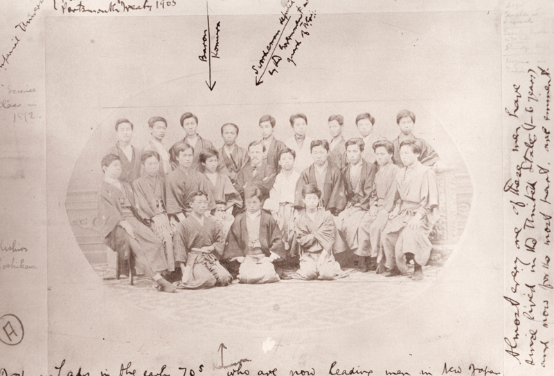 Old, sepia-toned portrait of a group of people