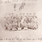 An old, sepia-toned portrait of a group of people